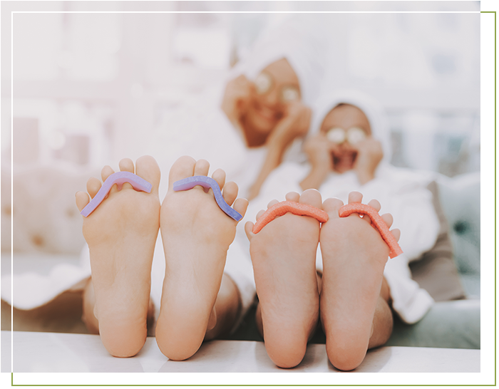 Two people getting pedicures at a spa